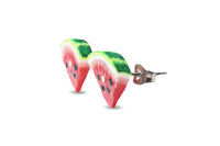 Thumbnail for The side view of a pair of watermelon slice stud earrings with heart seeds, made of polymer clay, displayed against a white background.