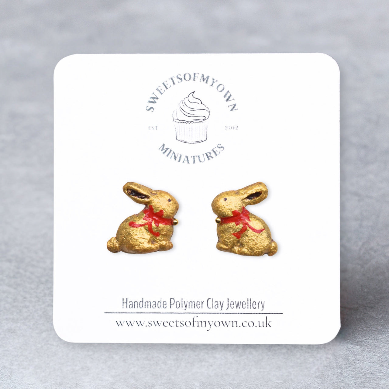 Gold Painted rabbit-shaped earrings on a white card with 'Sweets of My Own' branding.
