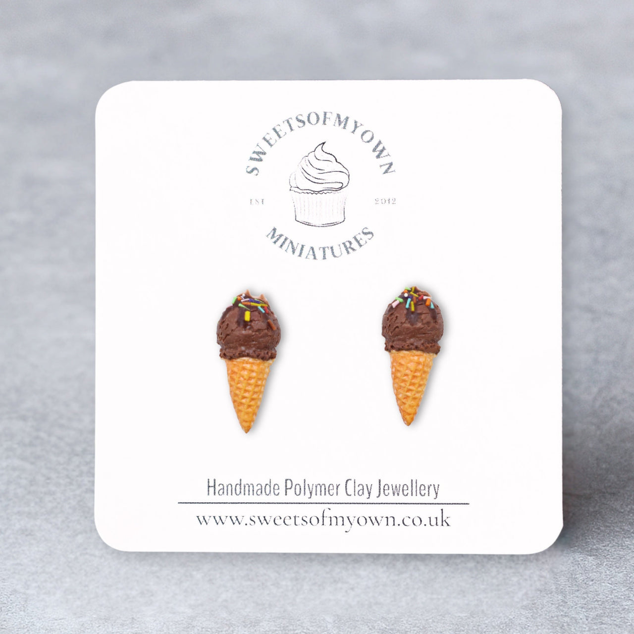 Chocolate single scoop ice cream cone stud earrings on a branded card with 'Sweets of My Own' logo.
