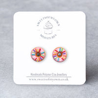 Thumbnail for Pink Doughnuts with Rainbow Sprinkles Stud Earrings on a Branded SweetsOfMyOwn Backing Card with a Grey Background