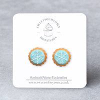 Thumbnail for Pair of snowflake-themed Polymer Clay Round Biscuit earrings on a branded card with 'Sweets of My Own' logo.