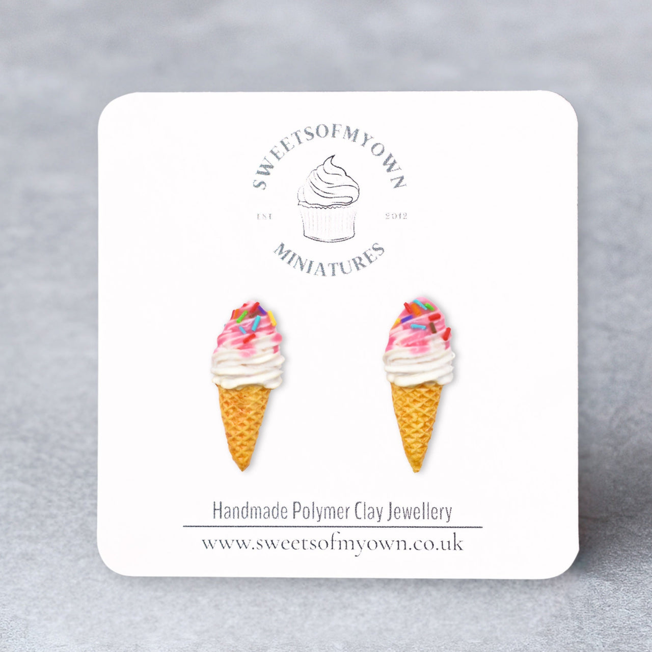 Ice cream cone with sprinkles stud earrings on a branded card with 'Sweets of My Own' logo.